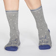 Pair of grey bamboo socks with 'And Relax' on them. 