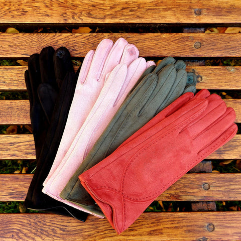 Gloves in four colours: red, green, pink and black. 