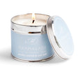 Pacific Orchid & Sea Salt Medium candle in a pale blue tin with a lid.